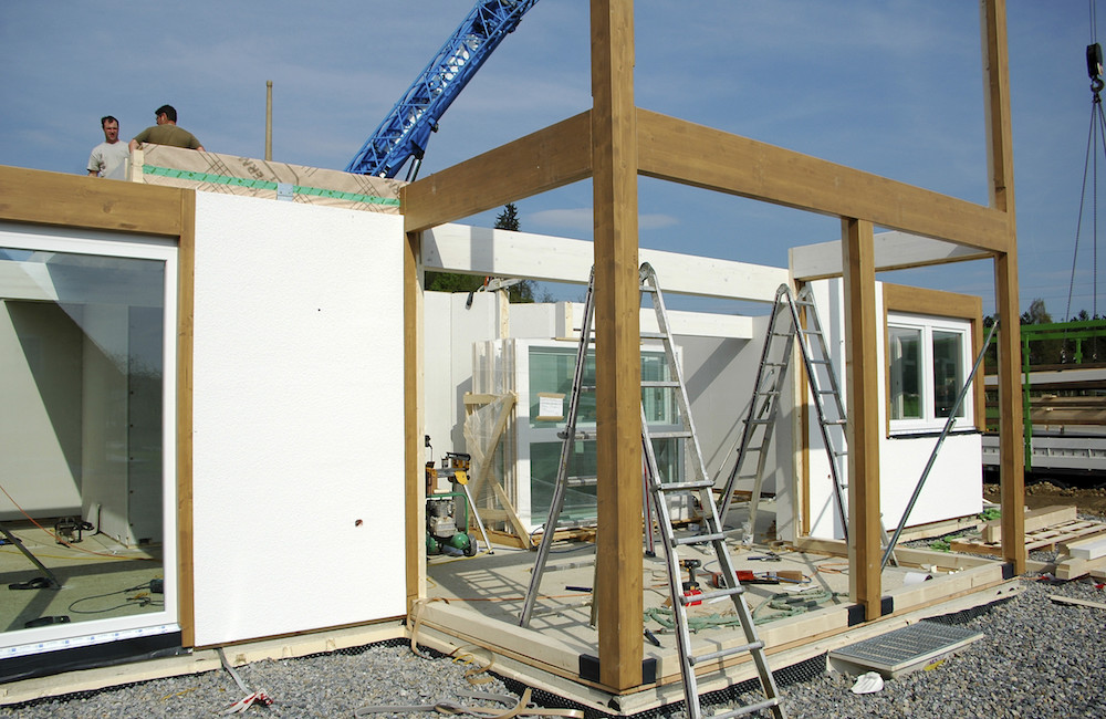 white prefabricated home under construction