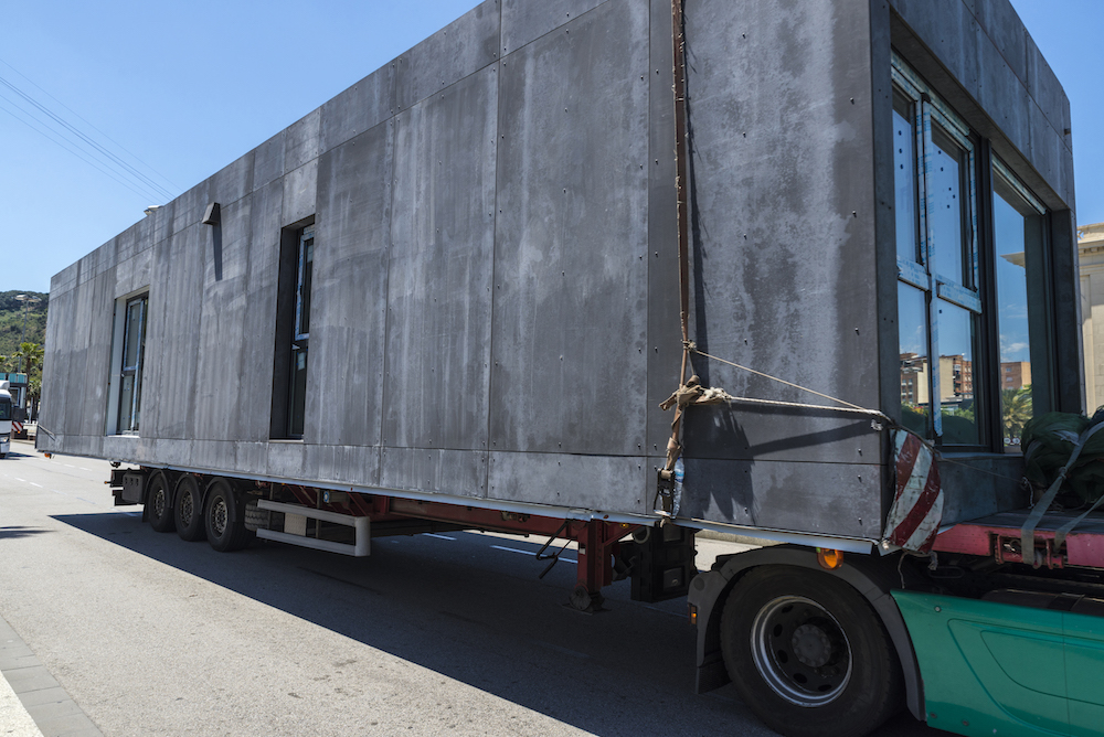prefabricated home on delivery truck