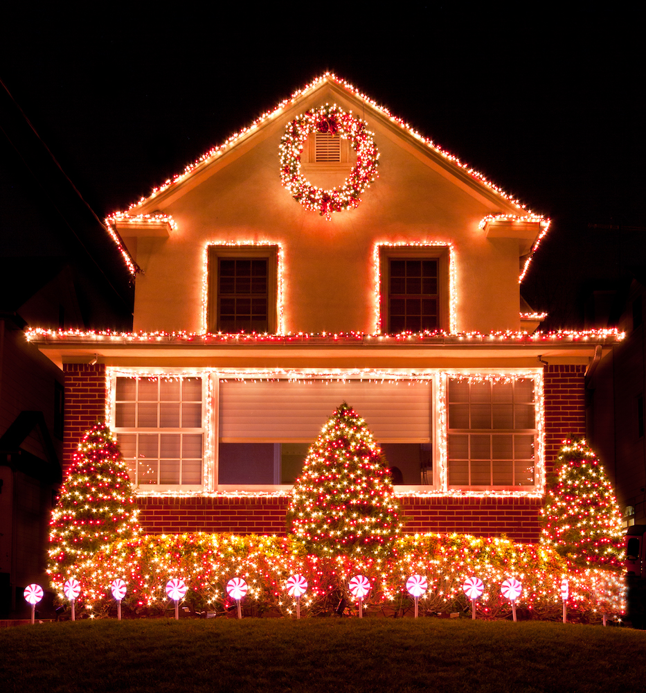 house with red Christmas lights on front and roof