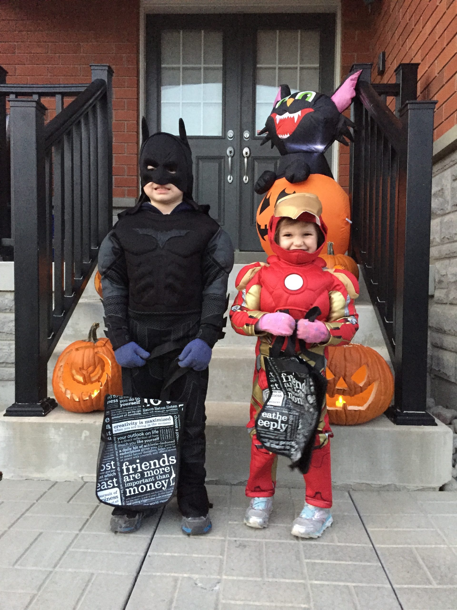 Mike Holmes' grandkids dressed up in Halloween costumes as Iron Man and Batman