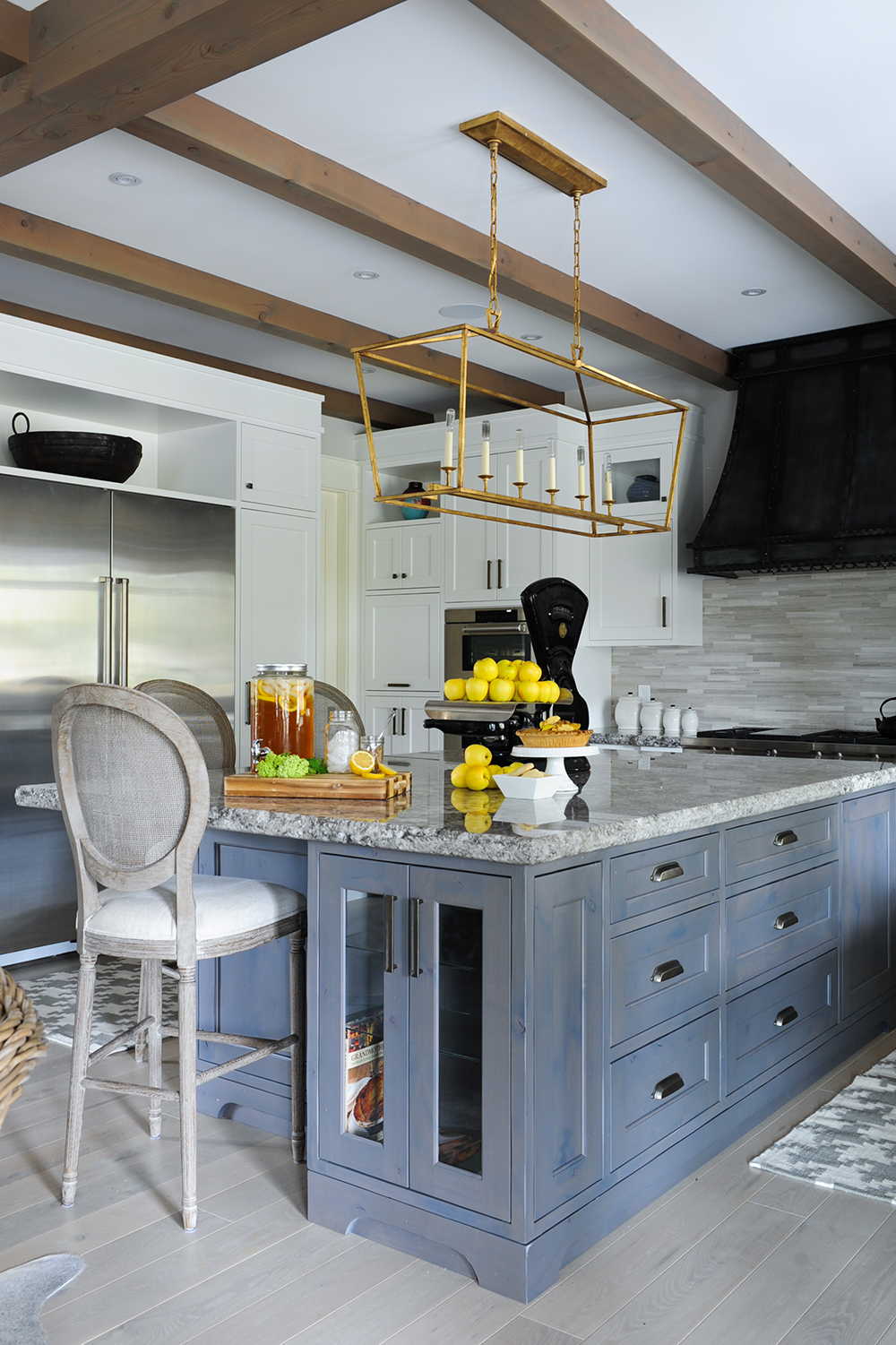 Stylish grey kitchen with integrated island cabinet for cookbooks