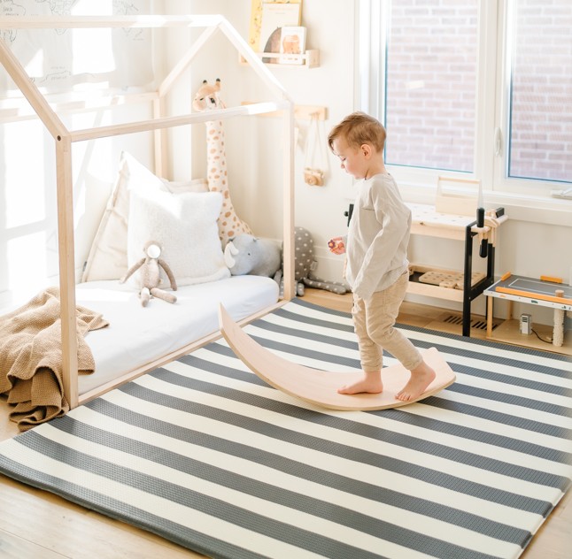 child playing on play mat