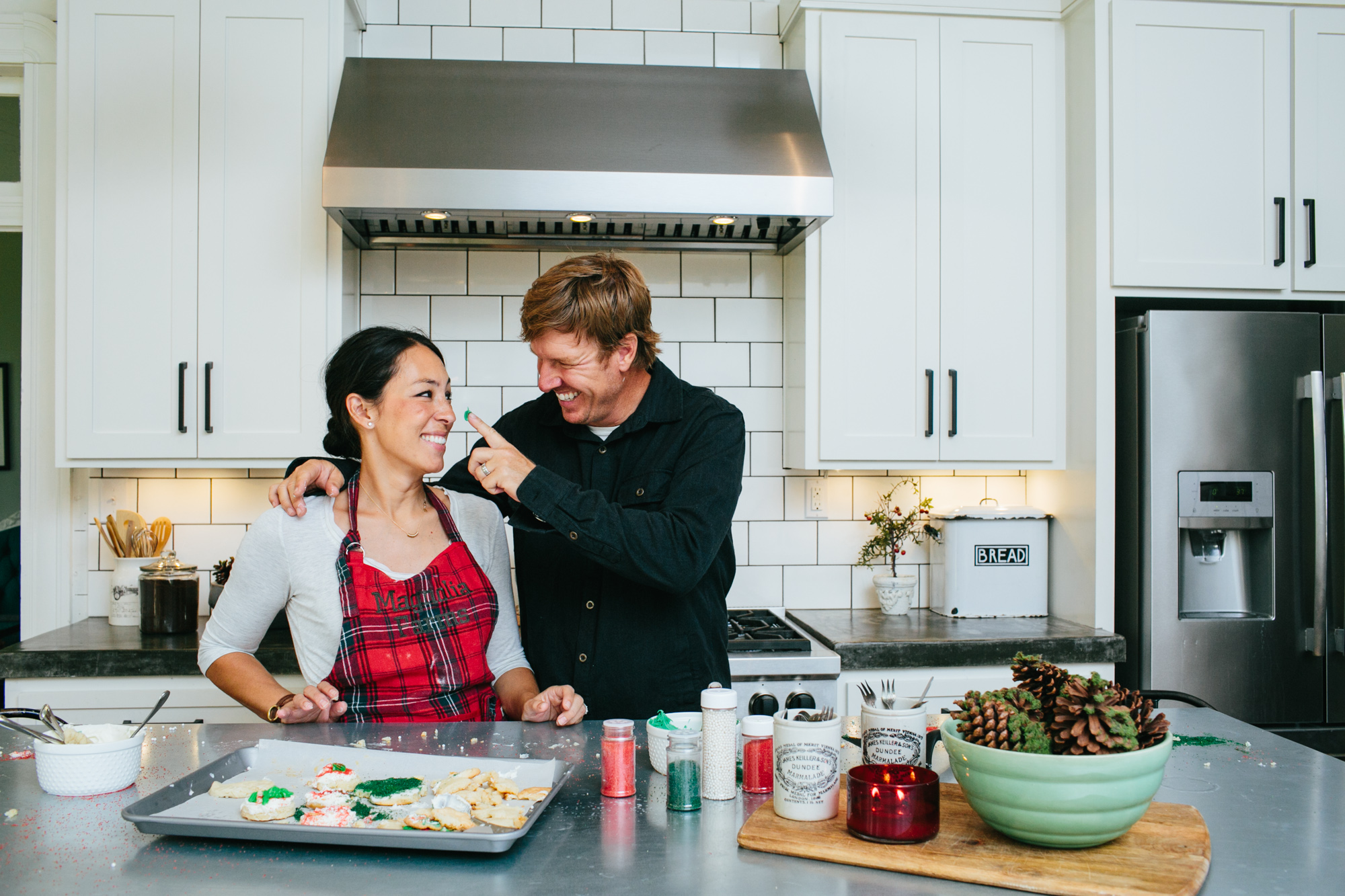 Chip and Joanna Gaines baking holiday cookies together.