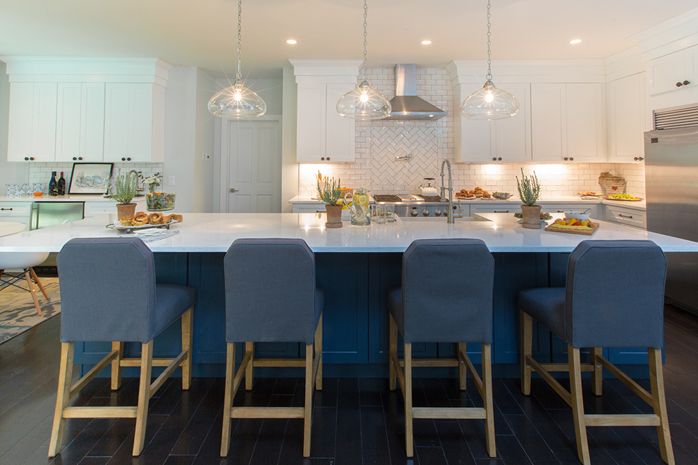 white kitchen with large kitchen island with blue base