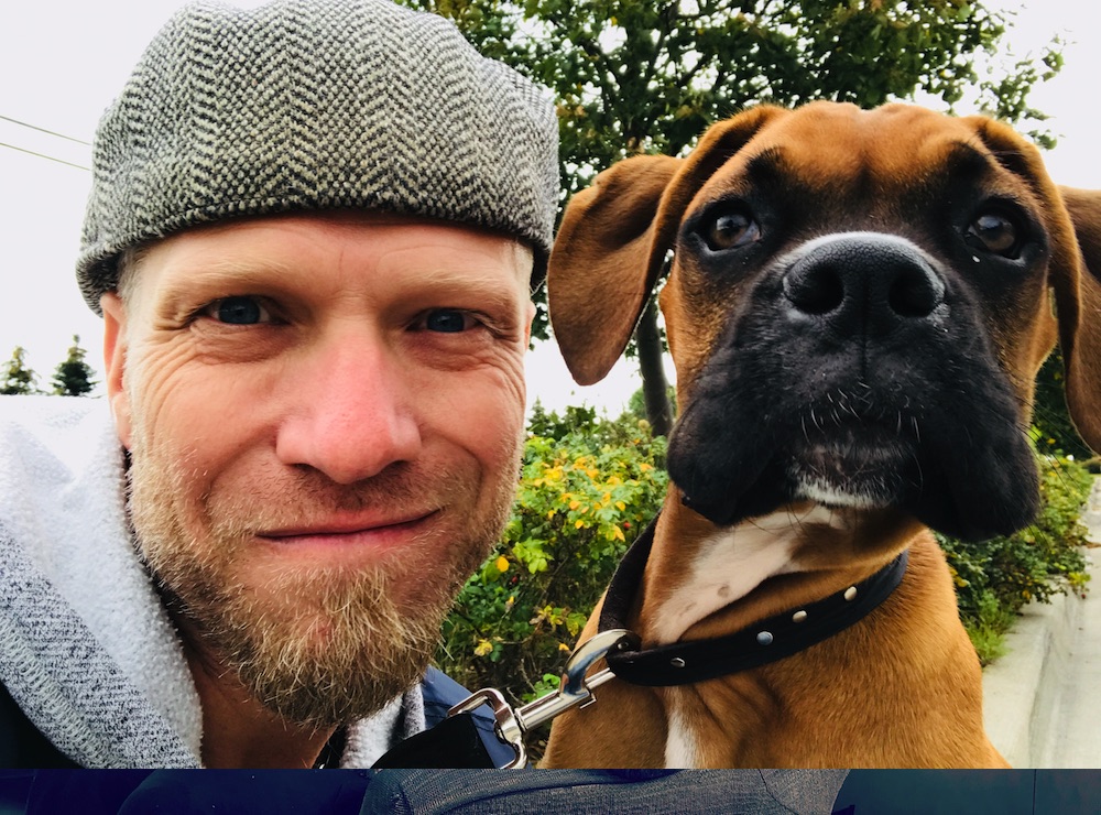 Paul Lafrance poses with his dog Cosmo