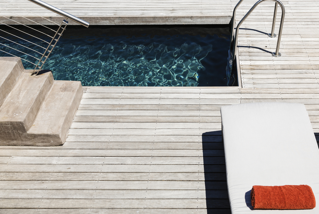 A custom-built lap pool integrated into the backyard deck