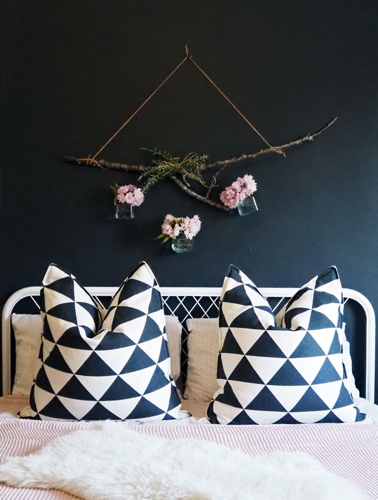 geometric patterned pillows on bed