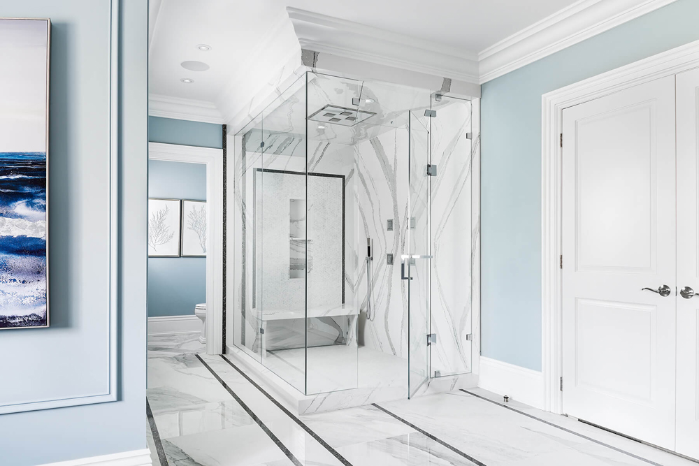 Beautiful blue and white marble bathroom featuring a large shower.