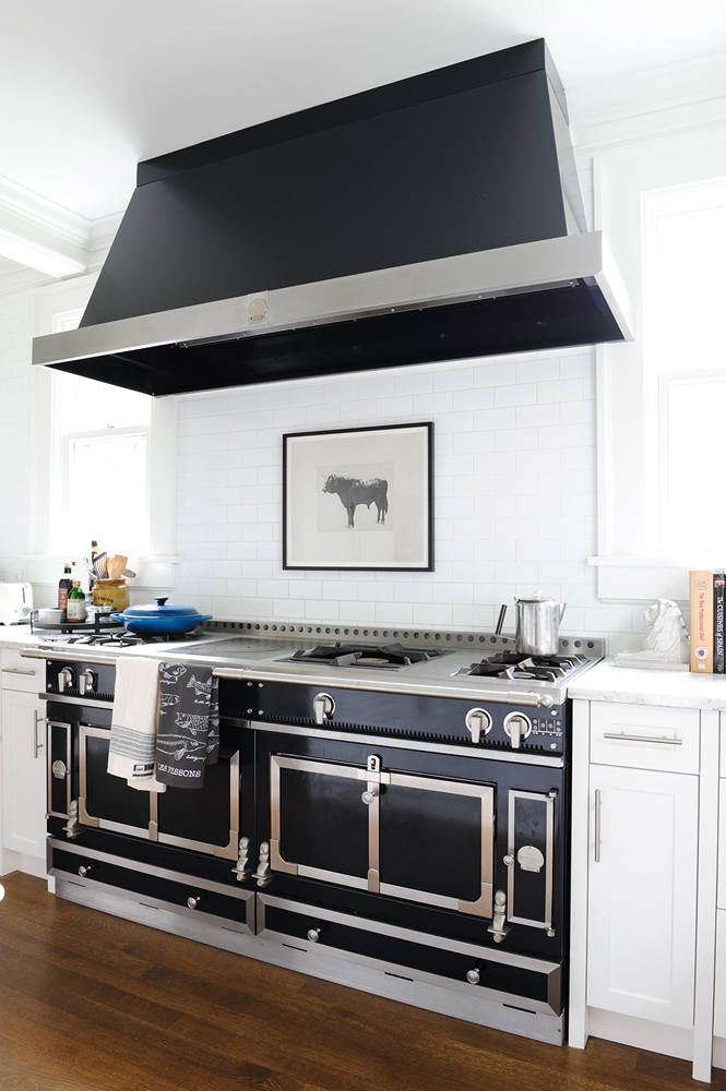Black hood range appliance in modern and stylish kitchen.
