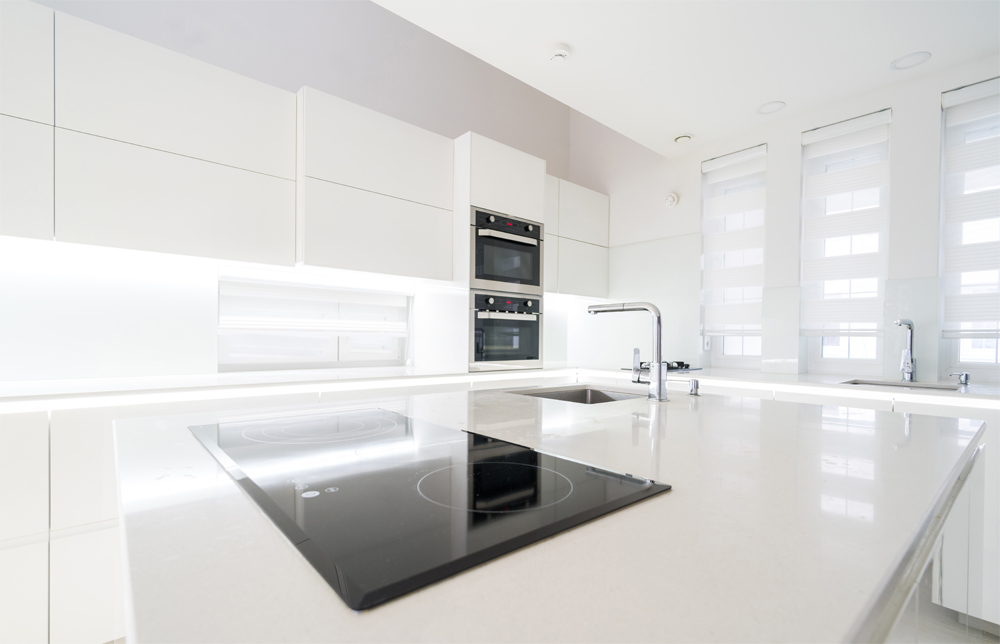 White and modern kitchen with SMART appliances featured throughout.