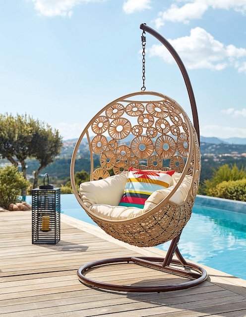Hanging basket chair on pool deck