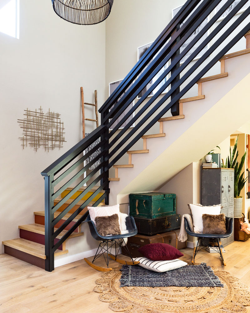 Black rails and wood stairs are an unusual combo that brings distinct flair to this corner.