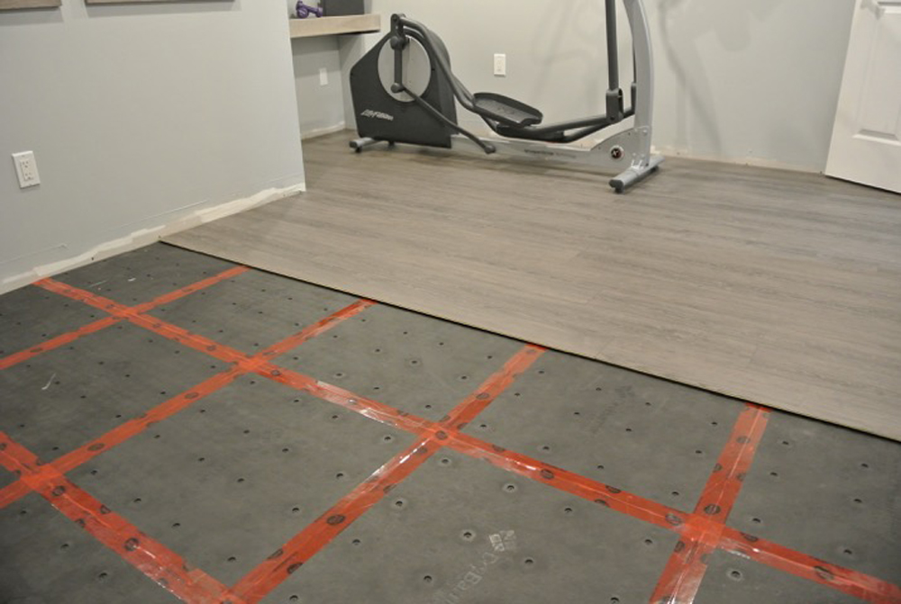 Basement subfloor with grey laminate on top