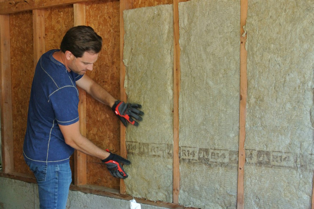 Scott McGillivray installing insulation