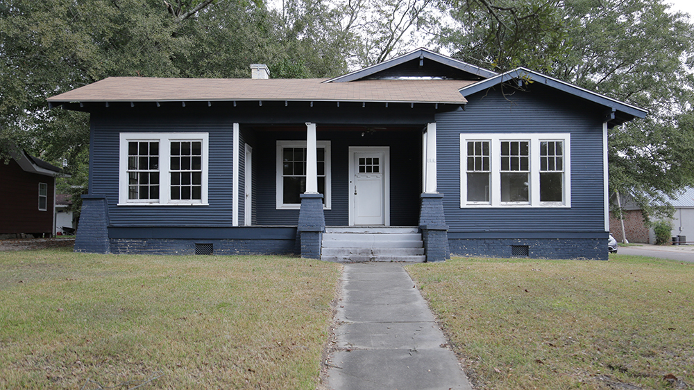 1920s home painted navy blue with white trim