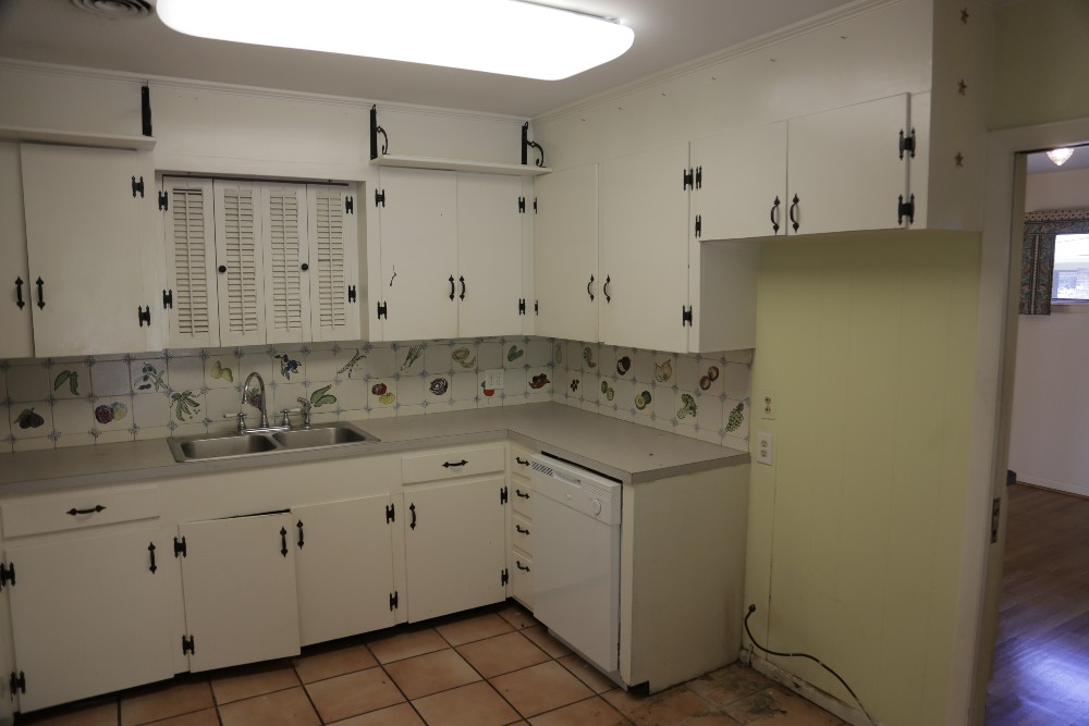 Dated 1960s kitchen with vegetable tiles