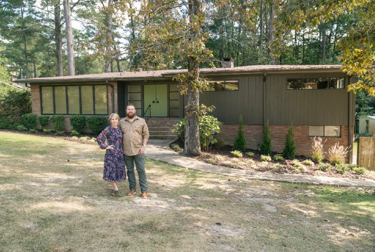Ben and Erin Napier Standing in front of mid century bungalow