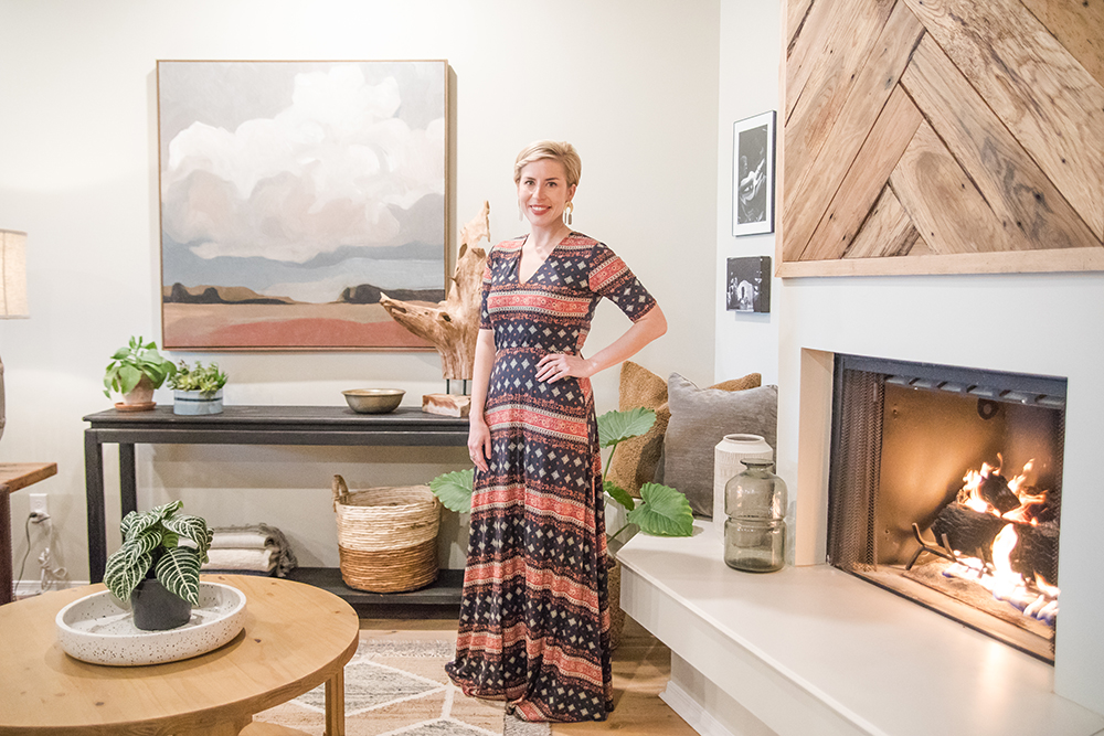 Erin Napier in front of a statement fireplace she designed