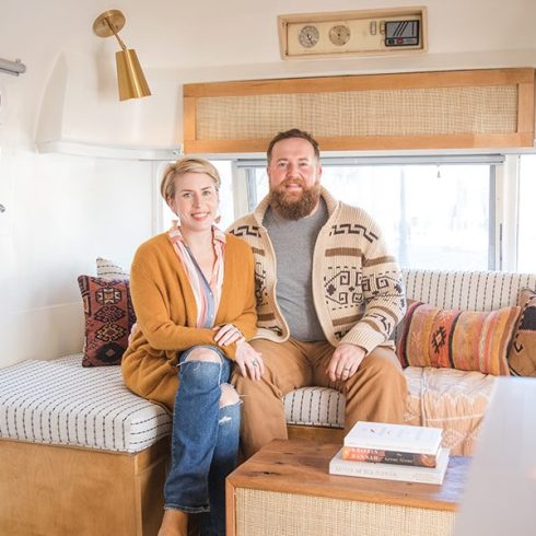 Erin and Ben Napier in the living room of their vintage airstream