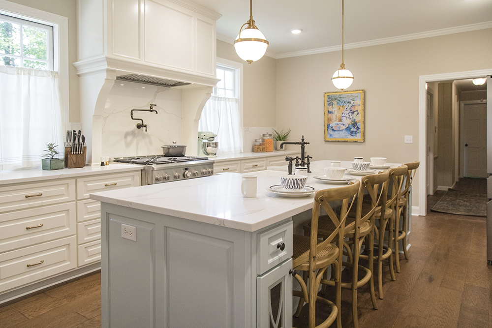 A bright, white kitchen with quartz countertop