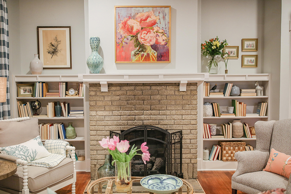 Brown brick fireplace with custom built-in shelves