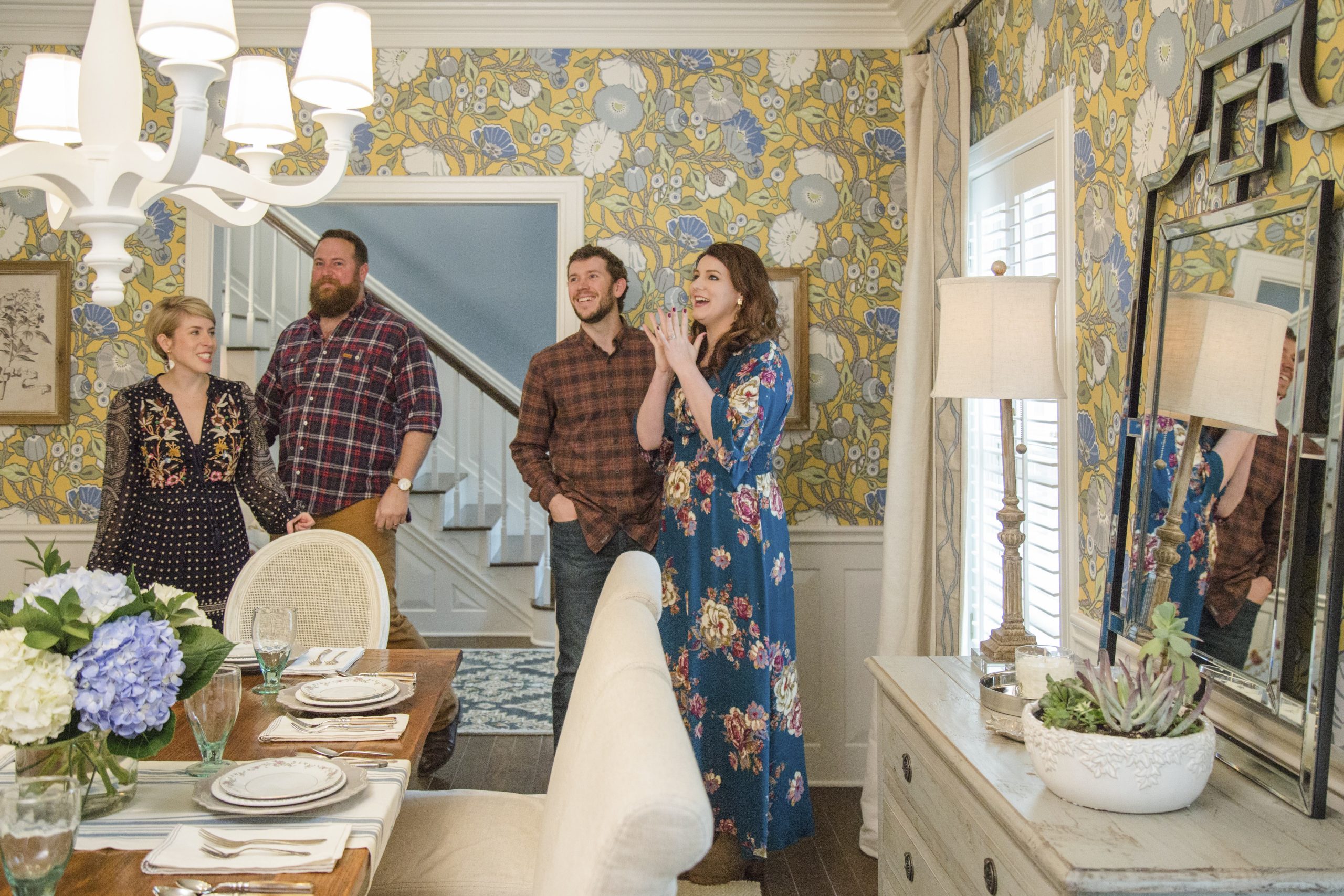 Ben and Erin Napier in the blue and yellow wallpaper dining room