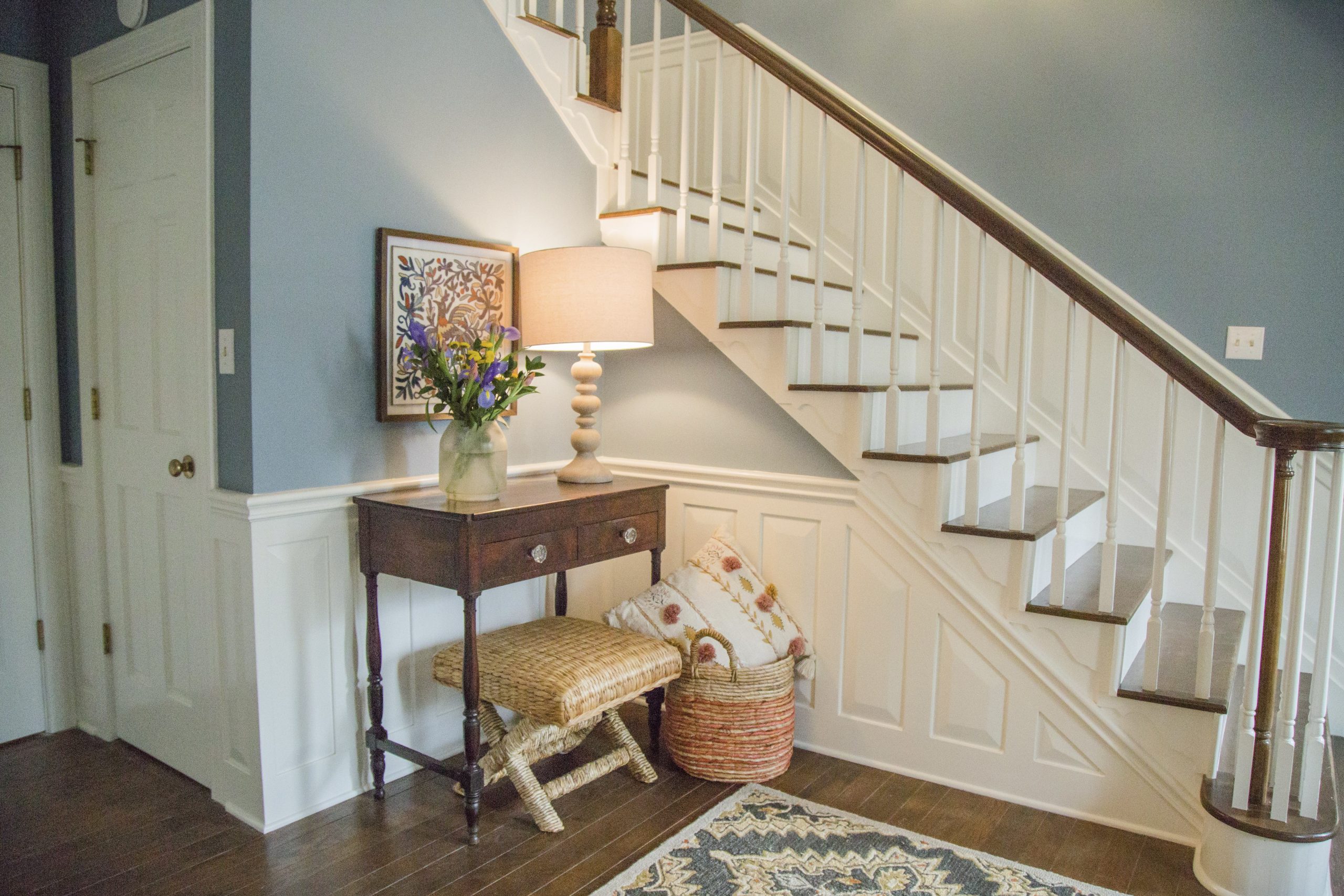 A calming blue and white entryway with traditional appeal