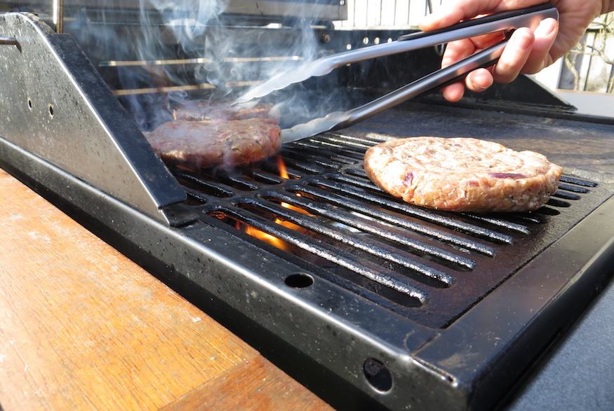 Barbecuing meat on gas grill