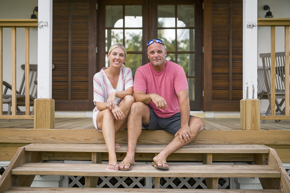 Sarah and Bryan Baeumler on the front porch of their Bahaman resort