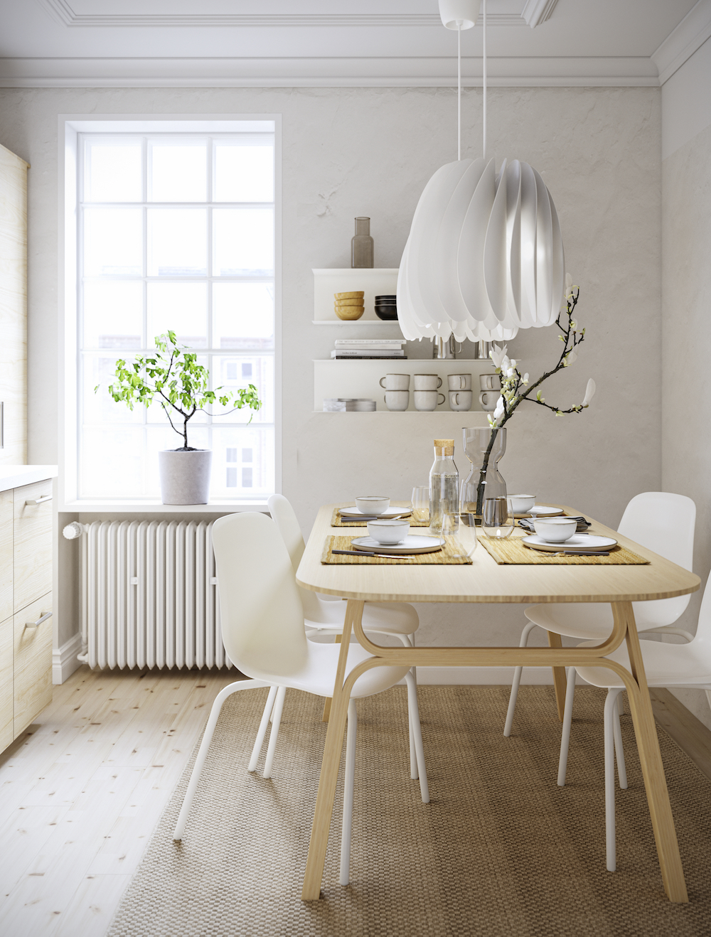 IKEA birch dining table with four white chairs in kitchen