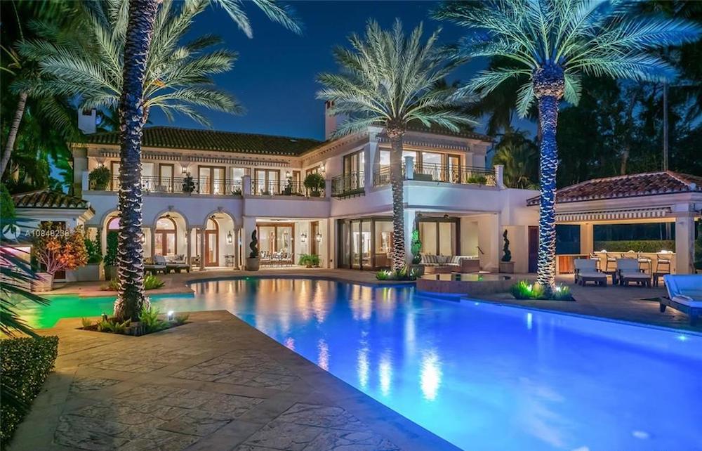 Backyard pool with palm trees
