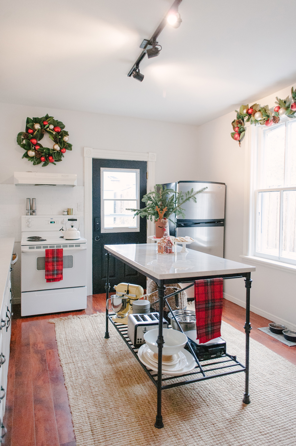 Kitchen with christmas decor and plaid tea towels