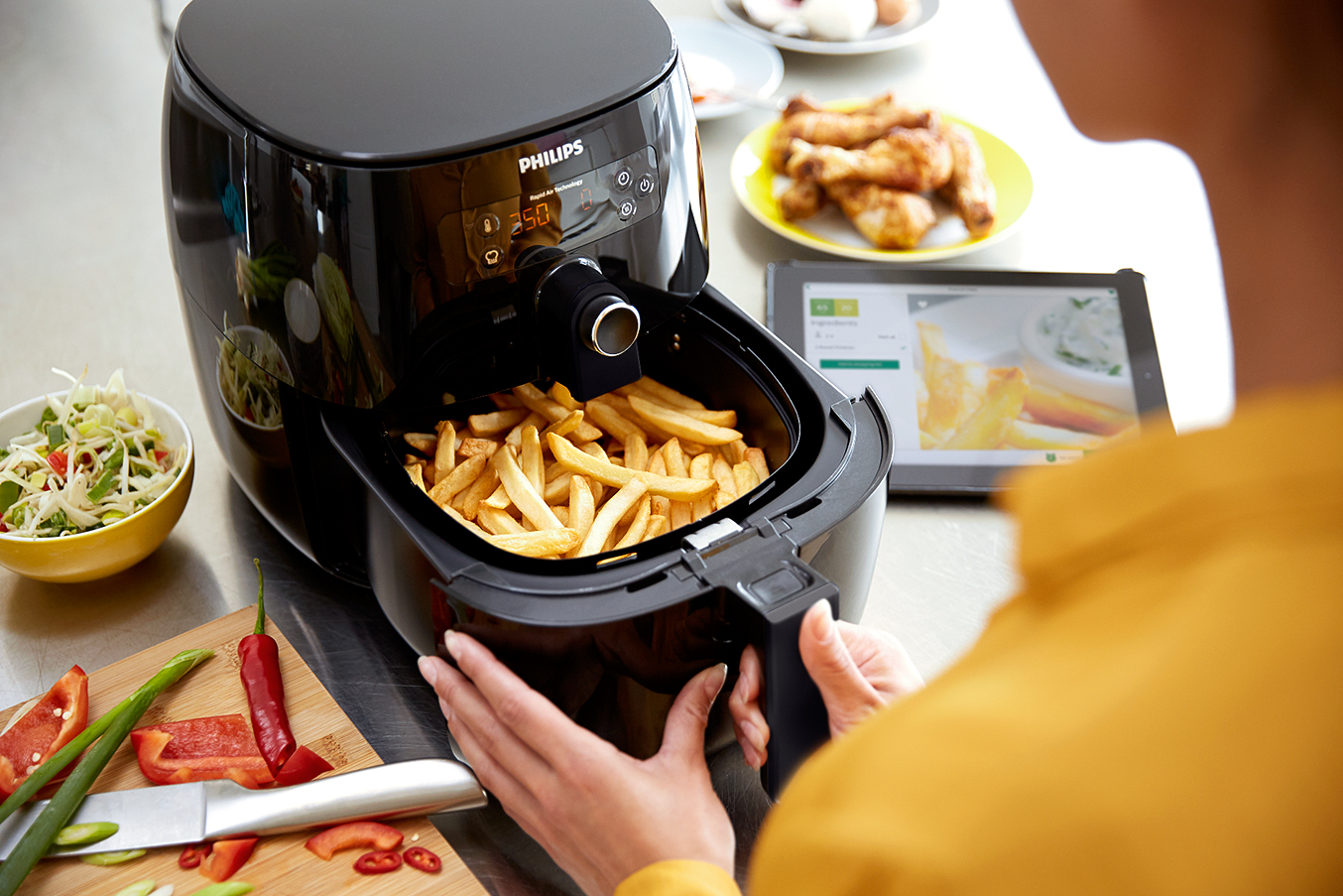 A Philips Airfryer filled with French fries