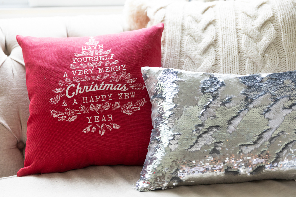 Christmas throw pillows on the living room couch