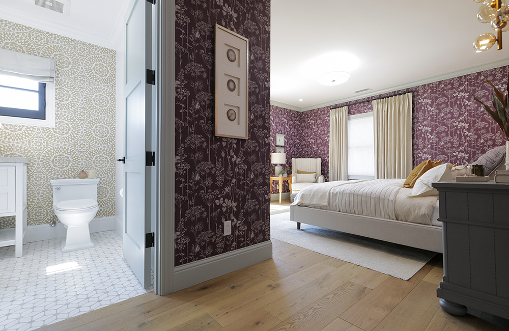 A bedroom with an ensuite bathroom