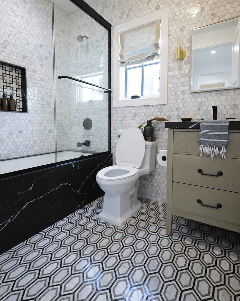 A bathroom with many patterned surfaces