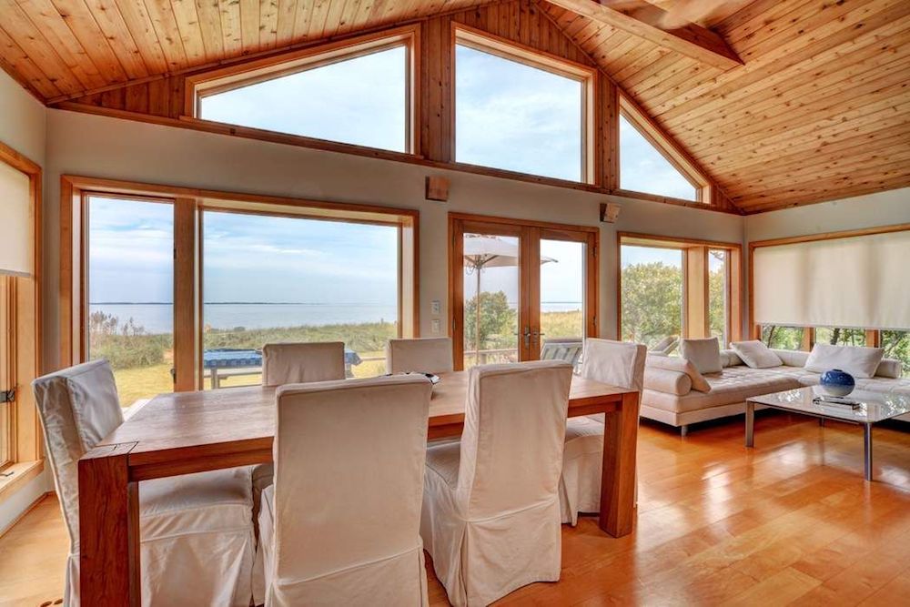 Open concept living/dining room of oceanfront cottage