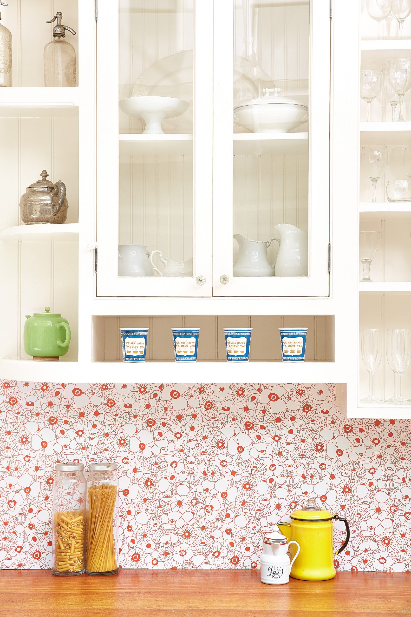 Floral wallpapered kitchen backsplash