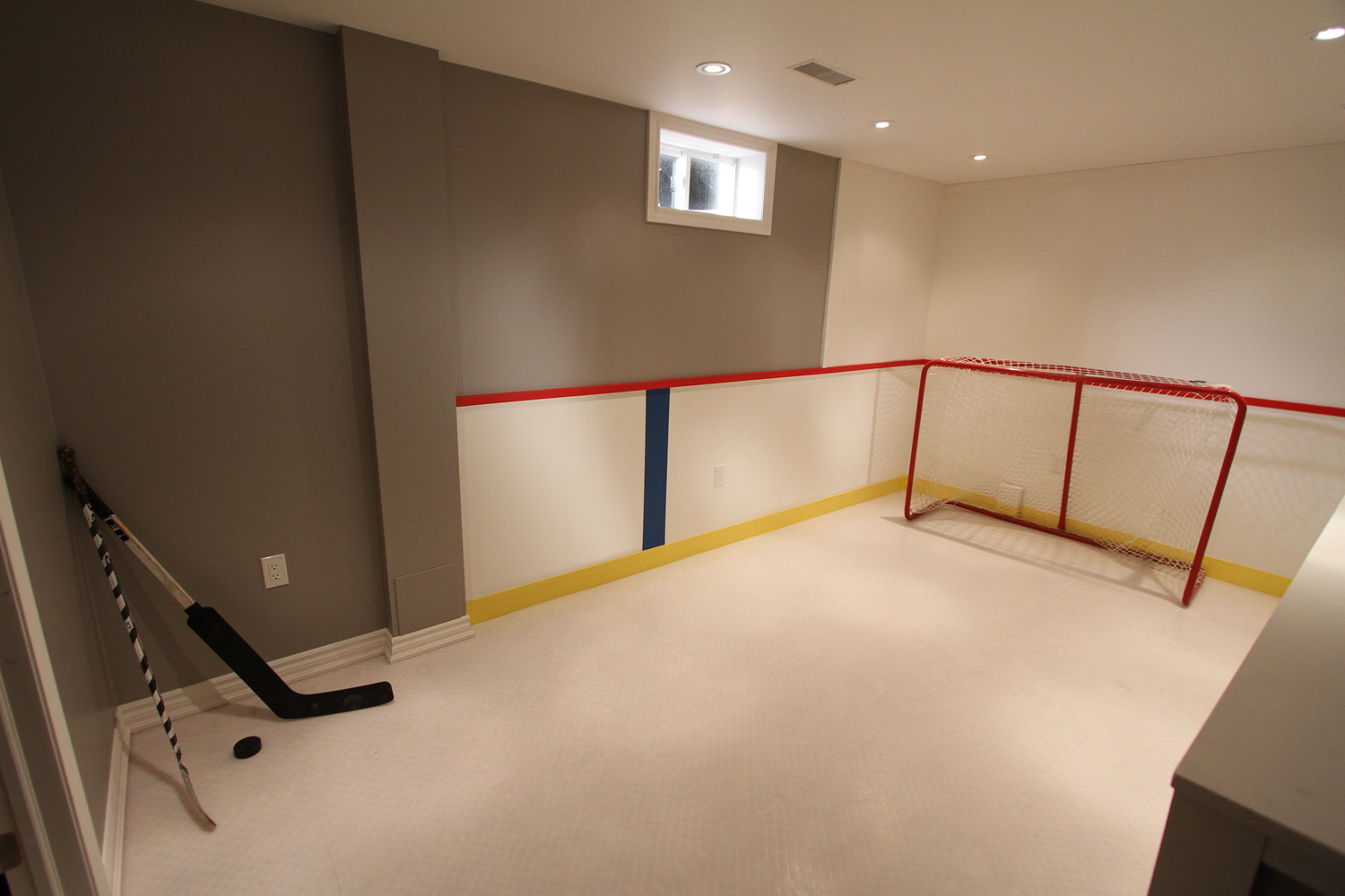 Hockey rink in basement