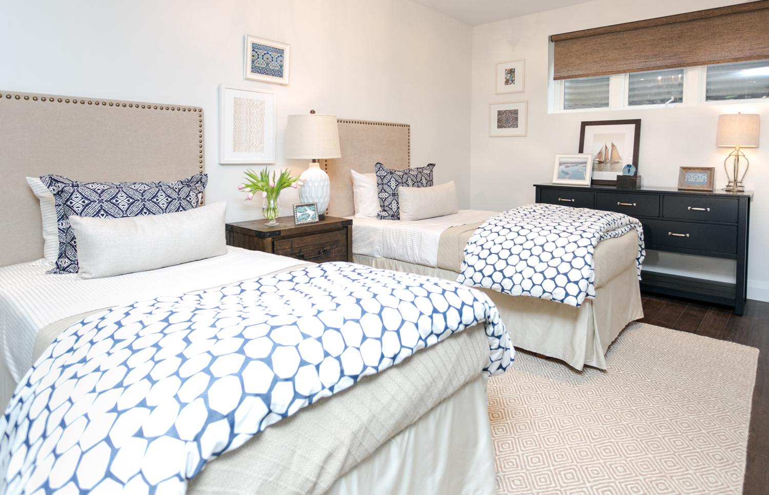 Contemporary basement bedroom with blue and white bedding