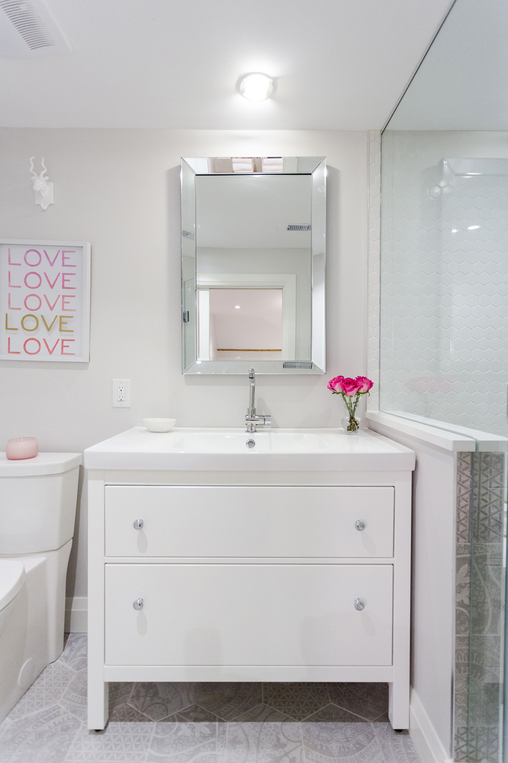 Dresser vanity in a white bathroom