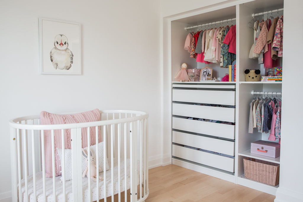 An adorable array of baby clothing and accessories in nursery