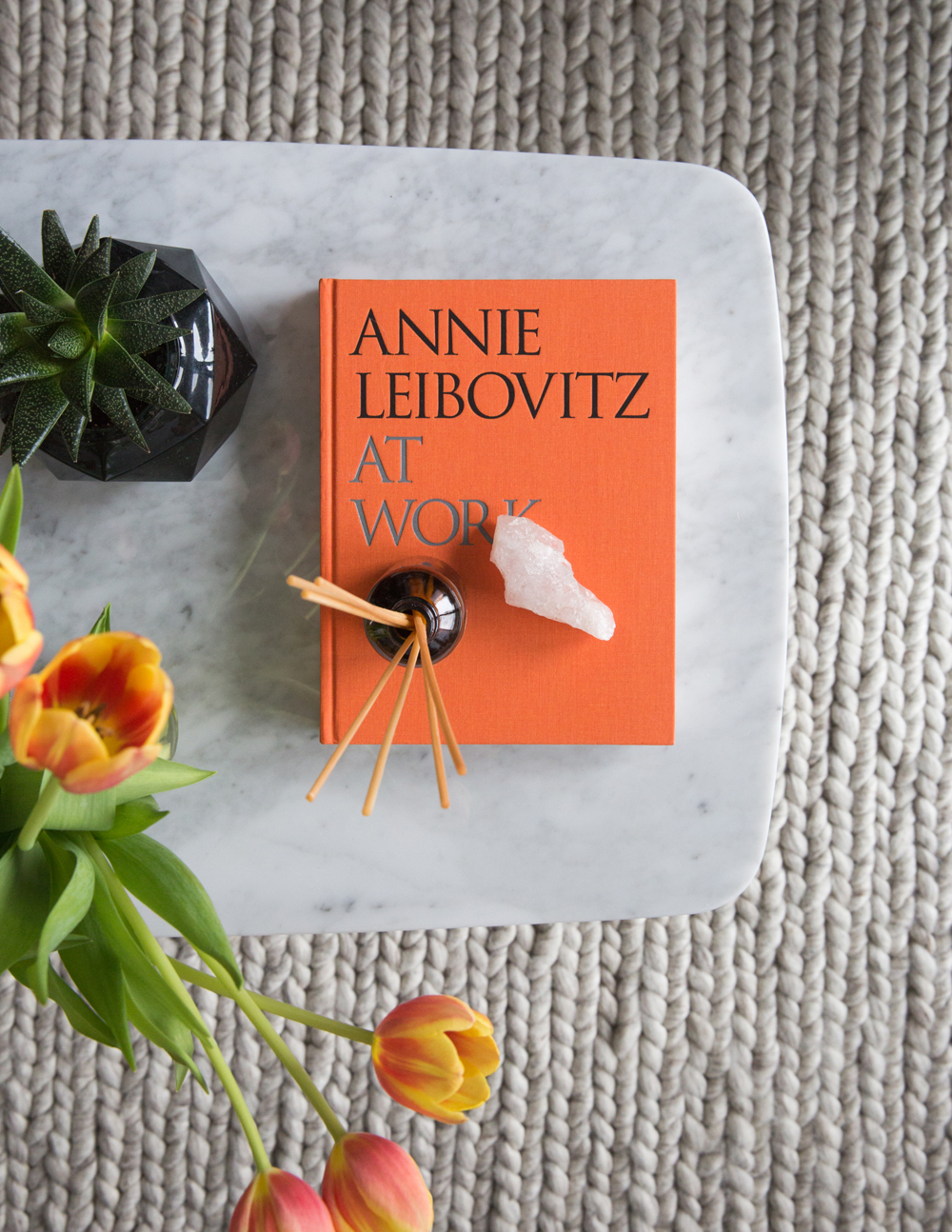 orange annie leibovitz coffee table book and tulips