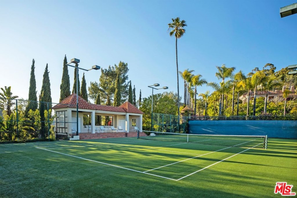 Outdoor tennis court with viewing pavilion