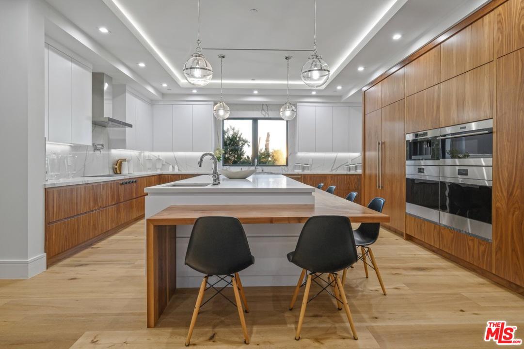 Contemporary kitchen with wood cabinets and island