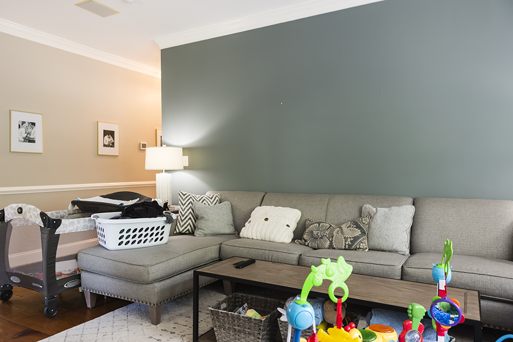A drab and cluttered family room
