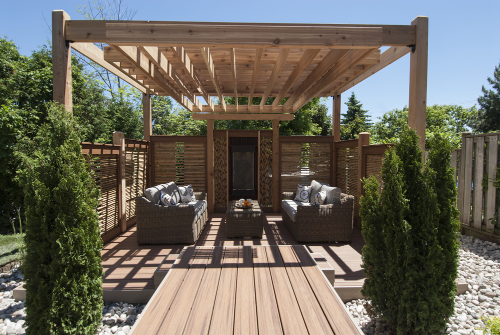 Seating area in a balanced, arbor-covered patio