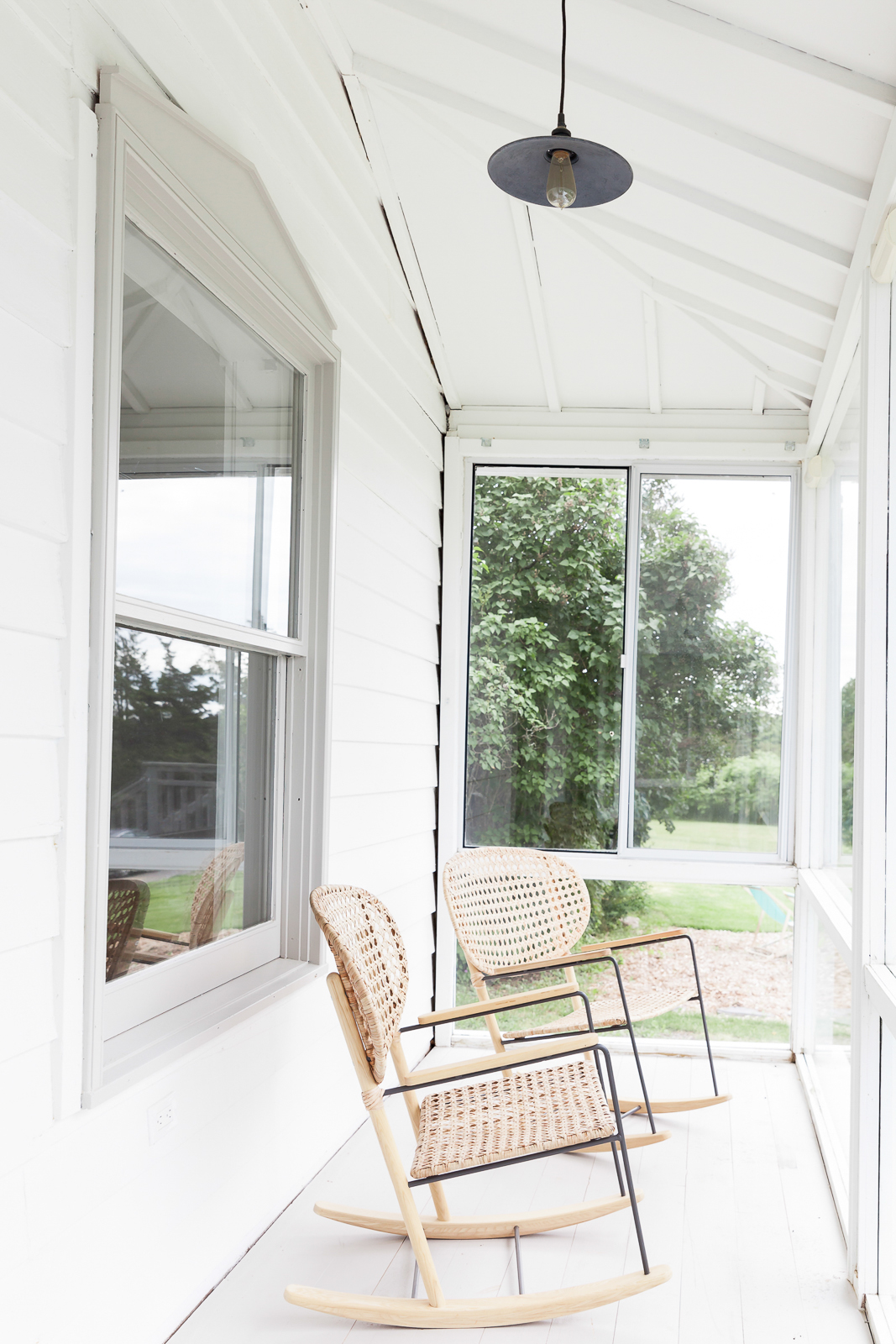 IKEA chairs on a front porch in Prince Edward County.