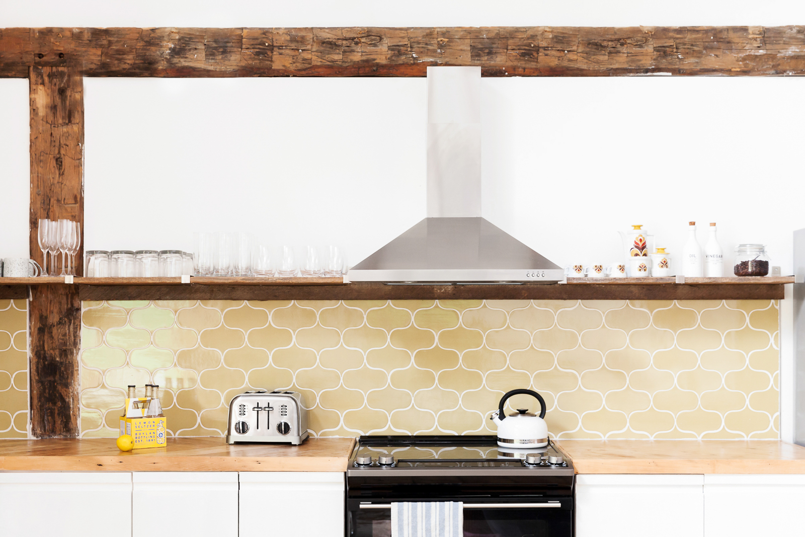Kitchen backsplash and appliances on countertop