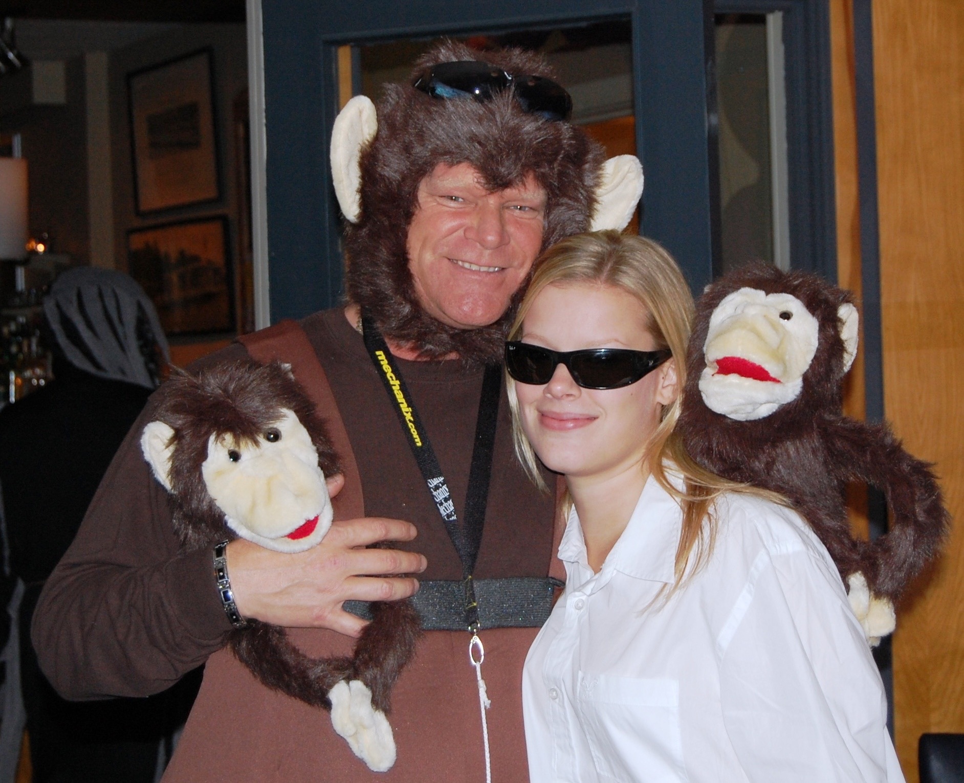 Mike Holmes dressed as a monkey while standing with his daughter